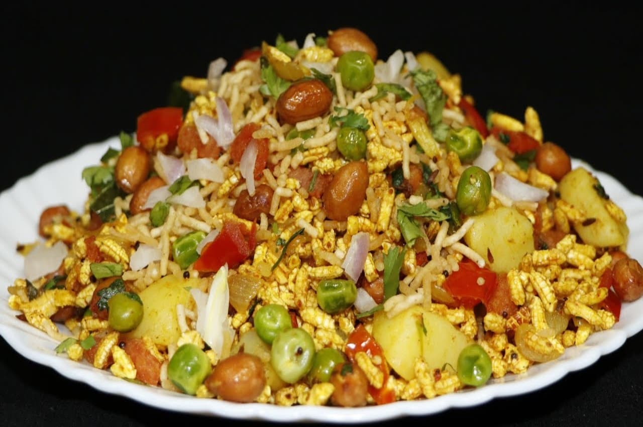 Kheel Chaat Recipe: दिवाली स्नैक में मात्र 10 मिनट में तैयार करें चटपटी खील चाट, ये रही रेसिपी