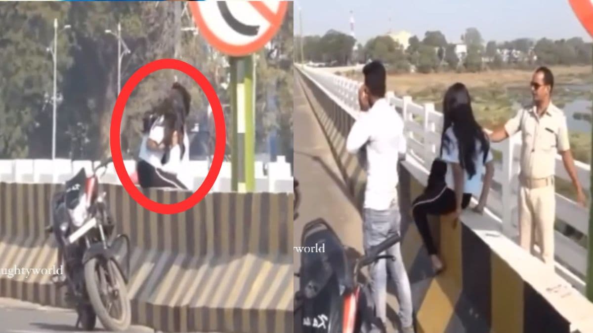 बीच सड़क कंट्रोल खो बैठा कपल! डिवाइडर पर बैठ करने लगे आशिकी; पहुंच गई पुलिस