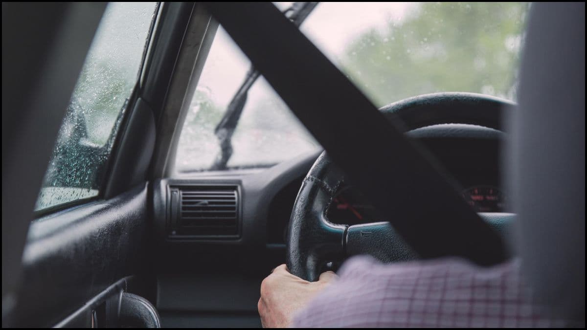 Man Driving A Car