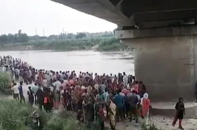 Tractor Trolley Falls Into River
