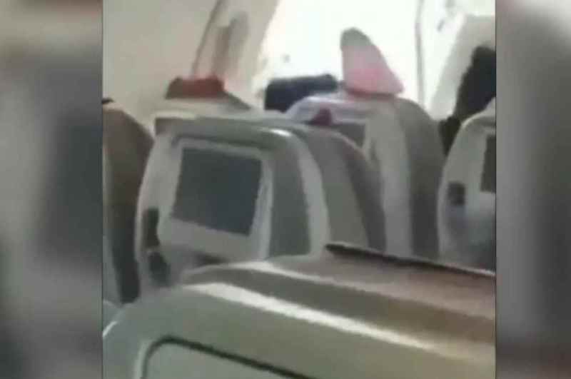 Passenger Opens Emergency Exit