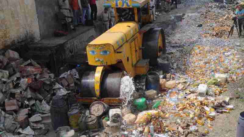 Bulldozer on Liquor Bottles Bhopal