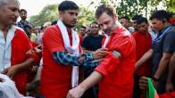 Rahul Gandhi Anand Vihar Railway Station lifts luggage