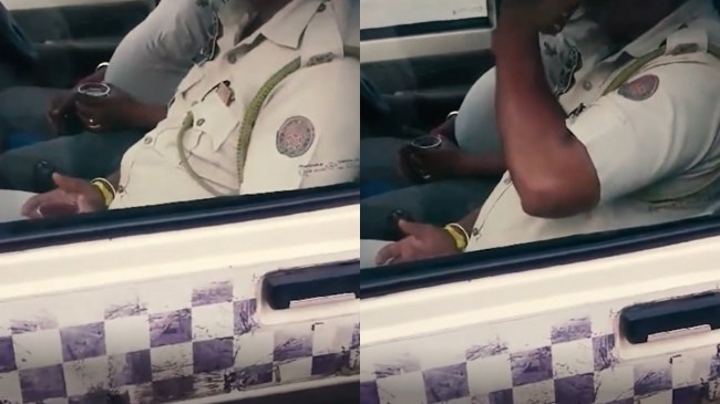 असम पुलिस के जवान ने ड्यूटी के दौरान पी शराब, वीडियो वायरल होने पर हुआ सस्पेंड