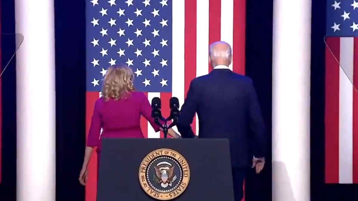 Biden being led offstage by first lady