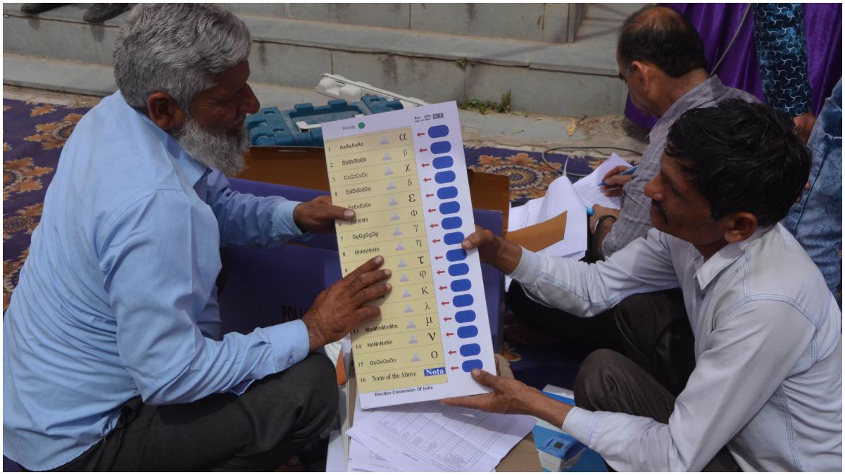 2 persons holding EVM