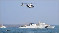 The Indian Coast Guard ship and helicopter during an exercise