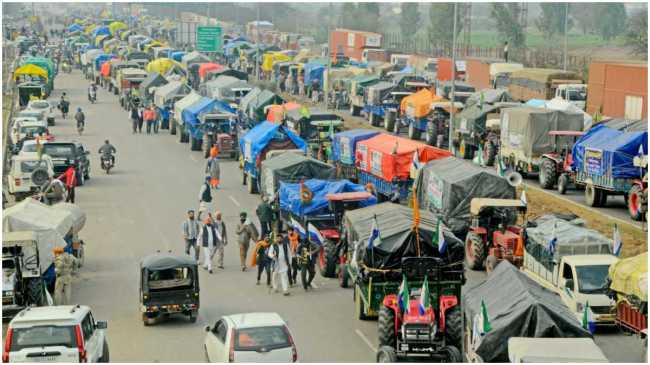 convoy of tractor trolleys of farmers