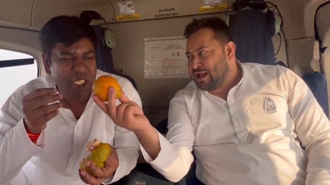 Tejashwi Yadav Mukesh Sahani Eating Orange in Helicopter Tejashwi Yadav Mukesh Sahani Eating Orange in Helicopter