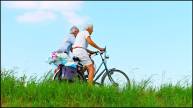Old Couple Riding Bicycle