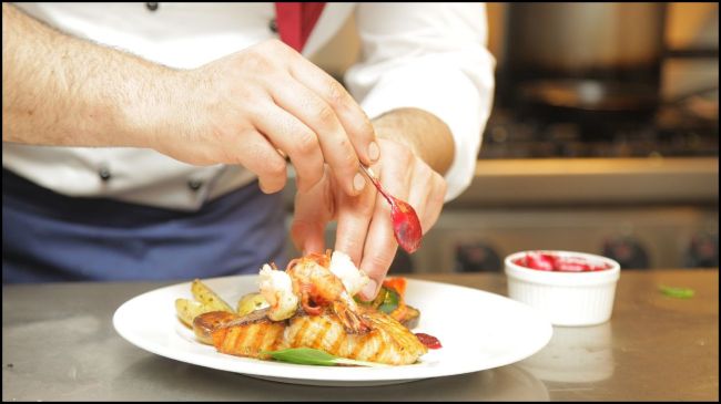 Chef Preparing A Dish