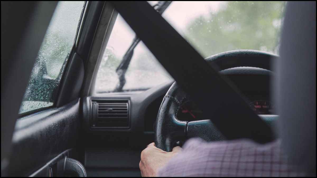 Man Driving A Car