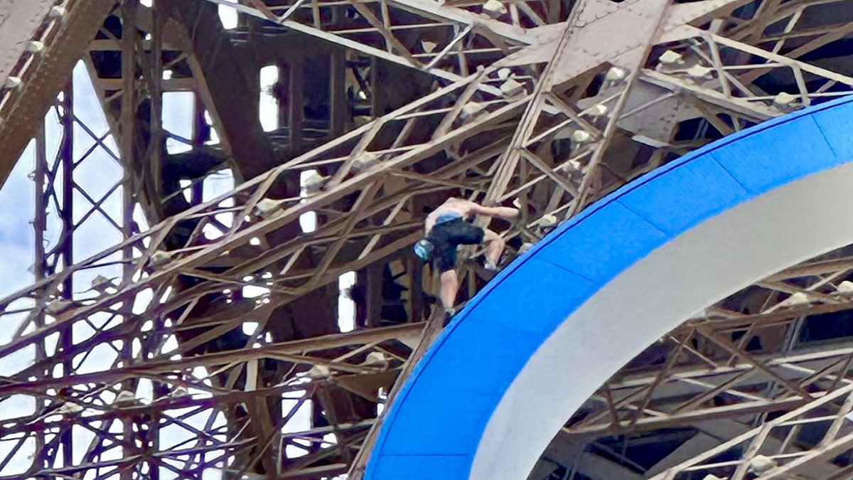 man climbed Eiffel Tower