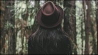 Woman Wearing A Hat In Forest