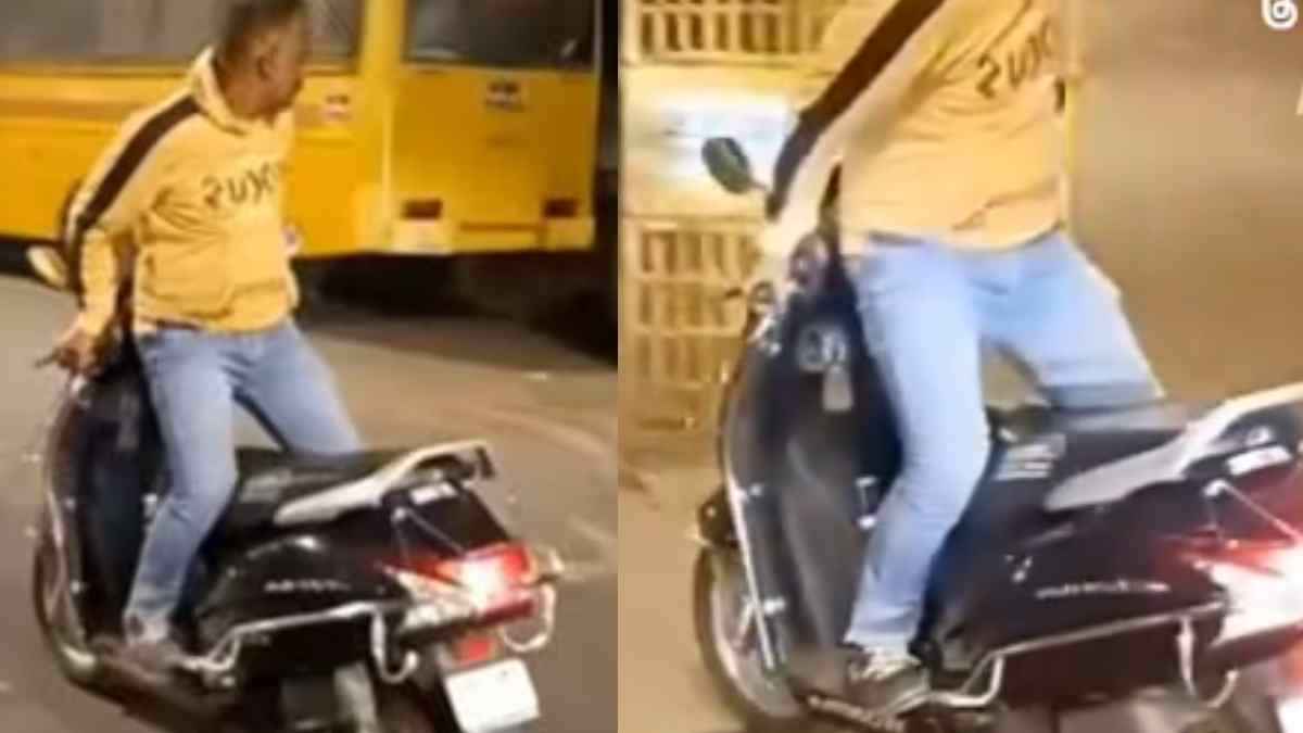 मूर्खता है ये! उल्टा बैठकर स्कूटी चलाते शख्स का वीडियो वायरल, भड़क उठे लोग