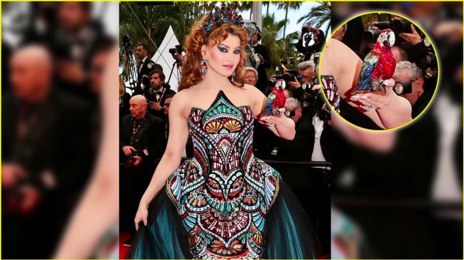 cannes film festival 2025 urvashi rautela trolled for bizarre look with parrot clutch