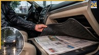 newspaper under car mat